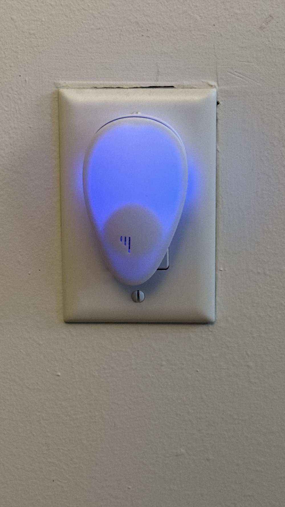 BanishBugs device plugged into wall outlet